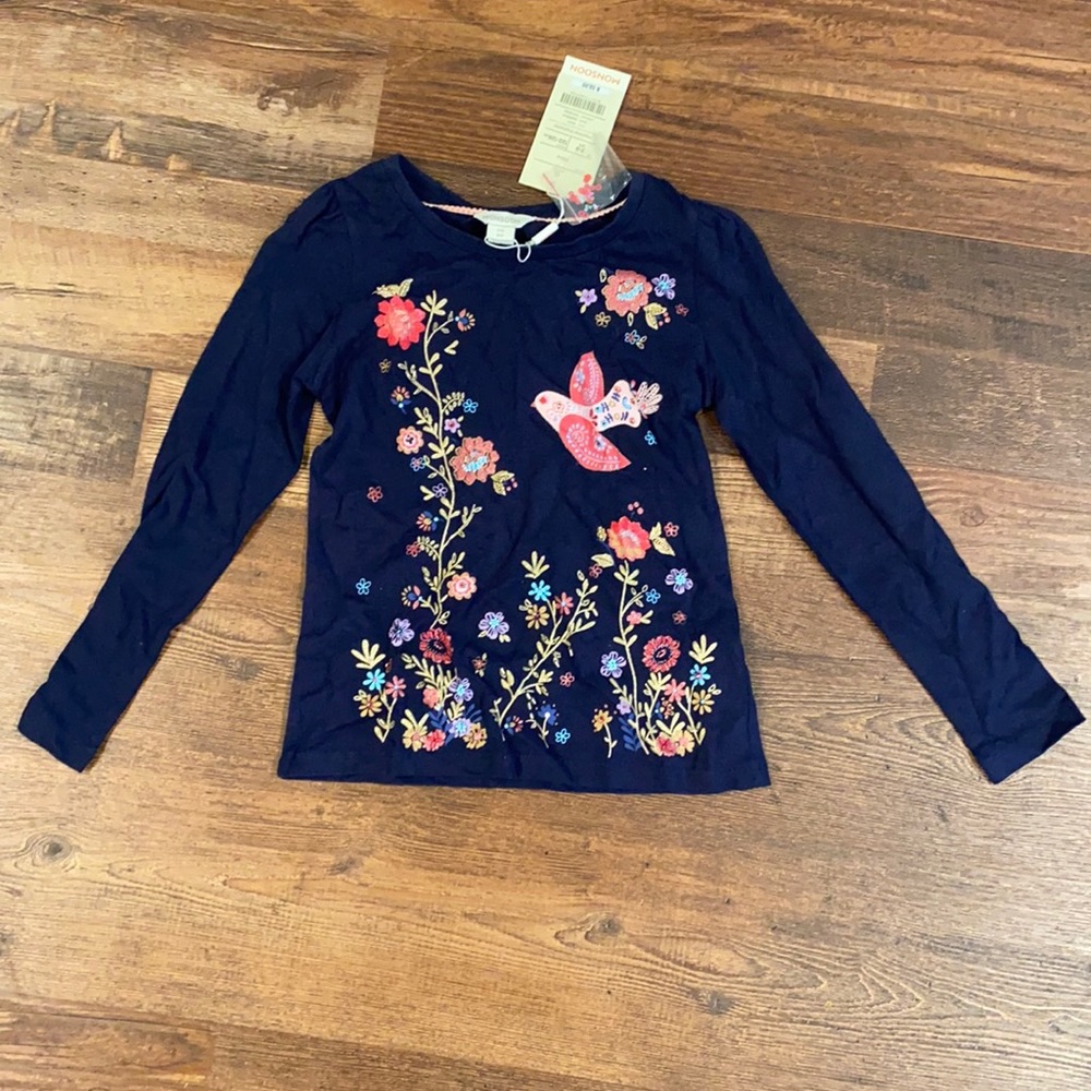 Long sleeve navy top with bird appliqués